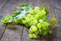 Bunch green grapes on wooden background food closeup