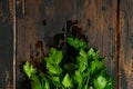 Bunch of green parsley, cilantro on wooden rustic table. Top view. Royalty Free Stock Photo