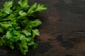 Bunch of green parsley on wooden rustic table. Top view. Royalty Free Stock Photo