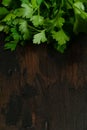 Bunch of green parsley on wooden rustic table. Top view. Royalty Free Stock Photo