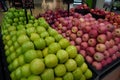 Bunch of green and pink apples on boxes in supermarket. Apples being sold at public market. Organic food Fresh apples in shop, Royalty Free Stock Photo