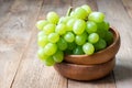 Bunch of green ripe grapes in bowl, copy space