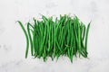 Bunch of green or string beans in rustic bowl on white table from above. Organic and diet food. Royalty Free Stock Photo