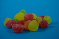 A bunch of gummies sweet on a blue background Royalty Free Stock Photo