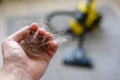 A bunch of hair in a man`s hand after vacuuming at home.