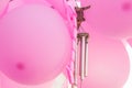 Bunch of hanging pink air balloons, wind chimes, curled ribbon, birthday party, baby shower decoration, valentine, romantic