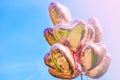 Bunch of Heart shaped ballons on the sky background