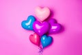 A bunch of heart shaped balloons on a pink background. AI generative image Royalty Free Stock Photo