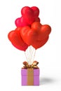 Bunch of heart shaped foil balloons and gift on white background. Royalty Free Stock Photo