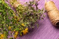 Bunch of herbal plants on the purple tablecloth