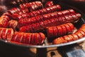 Bunch of hot dogs being grilled in a pan