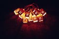 bunch of house shape Christmas garlands, illuminated glow light at night