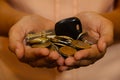 A bunch of Indian Currency Coins in Hand with car key. Royalty Free Stock Photo