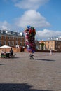 A bunch of inflatable helium balloons are for sale. Life on the streets of Warsaw in summer. Old city. Center street