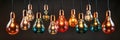 A bunch of isolated Vintage multi color light bulbs hanging from a ceiling. Panoramic image