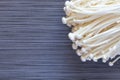 Bunch of japanese enoki mushrooms on dark background