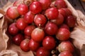 A bunch of juicy large red grapes in a paper bag Royalty Free Stock Photo