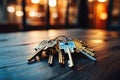 A bunch of keys from a new house on a wooden surface against a bokeh background. Generated by artificial intelligence Royalty Free Stock Photo