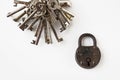 Bunch of keys and old padlock on white background Royalty Free Stock Photo
