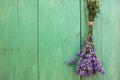 Bunch of lavender on a blue weathered wooden background with copy space.