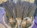 Bunch with lavender bouquets with texture bowls in basket close-up. Beauty products. Copy space. Royalty Free Stock Photo