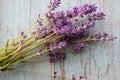 Bunch of lavender flowers on a blue weathered wooden background with copy space. Process of drying and storing garden herbs. p Royalty Free Stock Photo