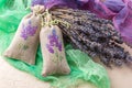 Bunch of lavender flowers and sachets filled with dried lavender. Royalty Free Stock Photo