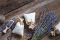 Bunch of lavender flowers and three sachets filled with lavender Royalty Free Stock Photo