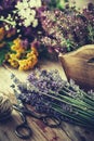 Bunch of lavender, thyme flowers in wooden box and healing herbs. Royalty Free Stock Photo