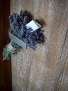 Bunch of lavenders with message written on piece of paper hanging on door handle