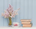 Bunch of lilac, books and teacup Royalty Free Stock Photo