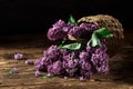 Bunch of lilac flowers in a basket. Still life with a luxurious bouquet Royalty Free Stock Photo