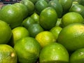 Bunch of limes for sale at a grocery store, fresh fruit Royalty Free Stock Photo