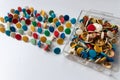 Bunch of many colorful thumbtacks as multi-color office supply metal pushpins circles in yellow, green, blue, red and white desk Royalty Free Stock Photo