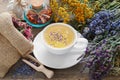 Bunch of medicinal herbs, healthy tea and bag of dry herbs.