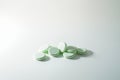 A bunch of medicinal pills and antibiotics, White medical tablets, light green, with copy space