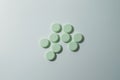 A bunch of medicinal pills and antibiotics, White medical tablets, light green, with copy space