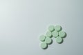 A bunch of medicinal pills and antibiotics, White medical tablets, light green, with copy space