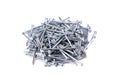 A bunch of metal nails isolated on a white background. Pile of nails. Scattered nails