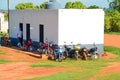 Bunch of motorcycles outside a poultry farm