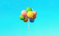 Bunch of multicolor balloons flying on blue sky background