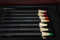 A bunch of multicolor colored pencils in an art set