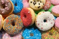 Bunch of multicolor donuts closeup