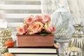 Bunch of multicolor roses lying on old book