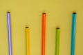 Bunch the multicolour wooden pencils isolated in yellow background