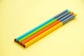 Bunch the multicolour wooden pencils isolated in yellow background