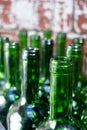 Neck of green empty wine bottles