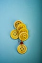 Bunch of old buttons lay on a blue background Royalty Free Stock Photo