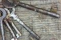 Bunch of old rusty keys on dark wooden background, closeup Royalty Free Stock Photo