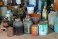 Bunch of old rusty paint cans in a rack - In the workshop